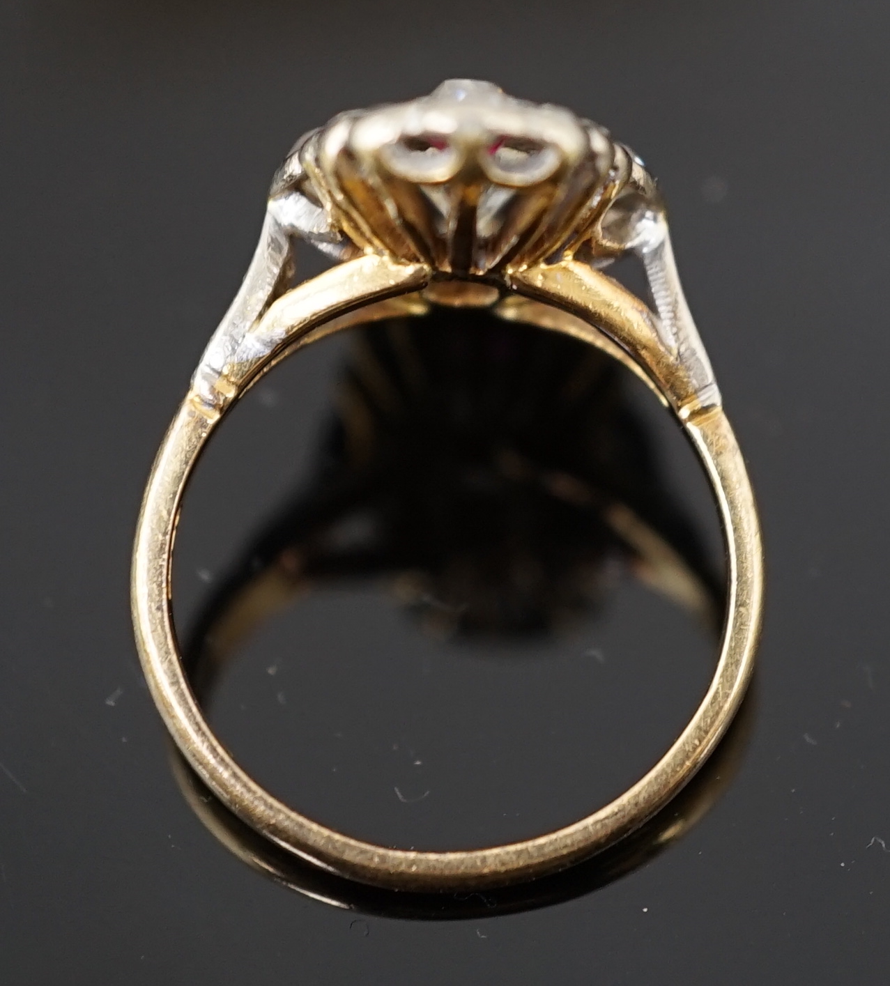 An 18ct gold ruby and diamond cluster ring